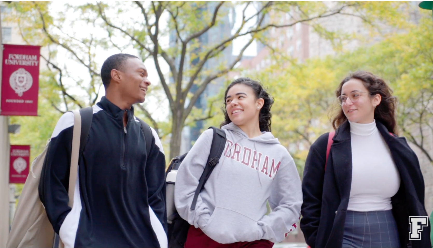 Social fundraising campaign page for Fordham University's Giving Day featuring three happy students walking together.