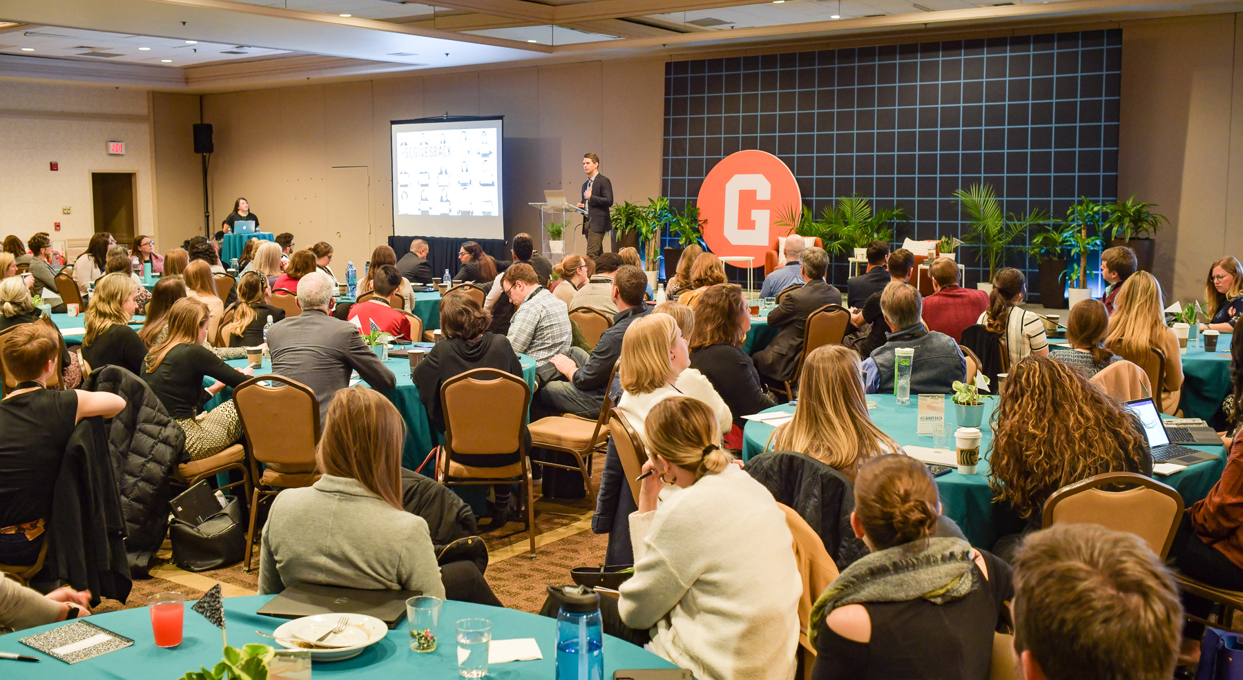 GiveCampus CEO addressing standing-room-only audience at GiveCampus Partner Conference.