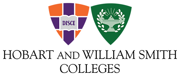Two crests, one orange and purple and the other green.
