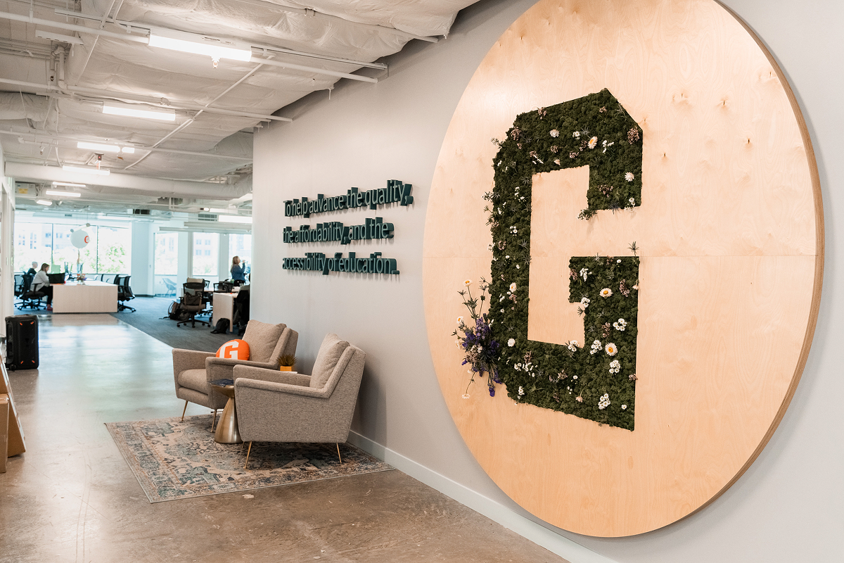 The entryway to GiveCampus headquarters in DC, displaying the company's mission.